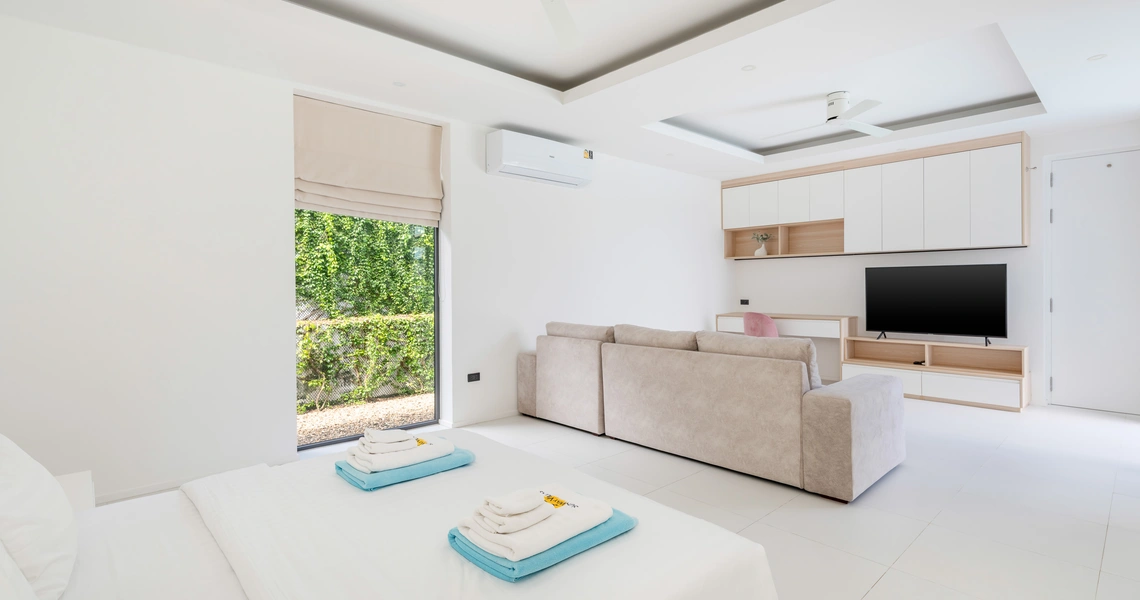 Hideway Villa Samui - bedroom suite with TV and sitting area