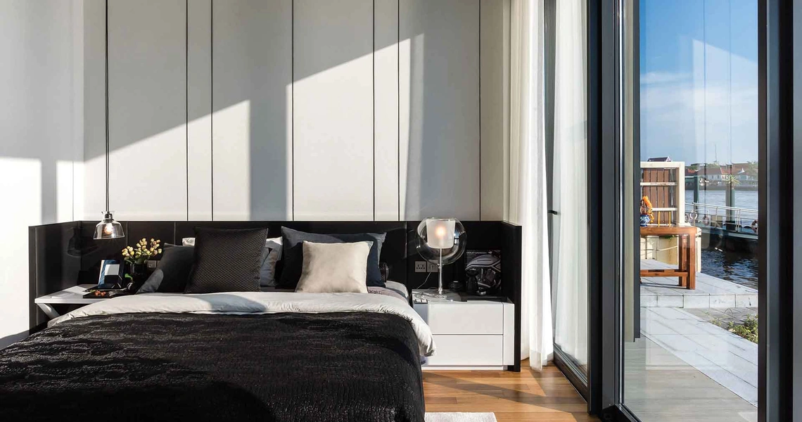 Banyan Tree Riverside Residences Bangkok bed and side view