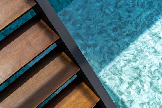 None Wooden and metal staircase over a pool in a luxury villa on Phuket