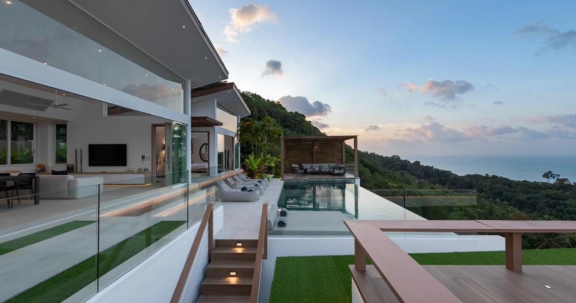 Pacific Palisade Samui luxury villa - swimming pool and deck at dusk