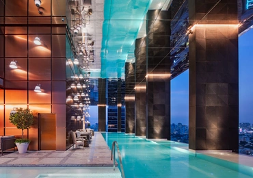 None Khun by Yoo luxury condo in Bangkok pool and city